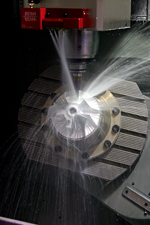 Machined aluminium impeller under the milling head. Illustrative photography
